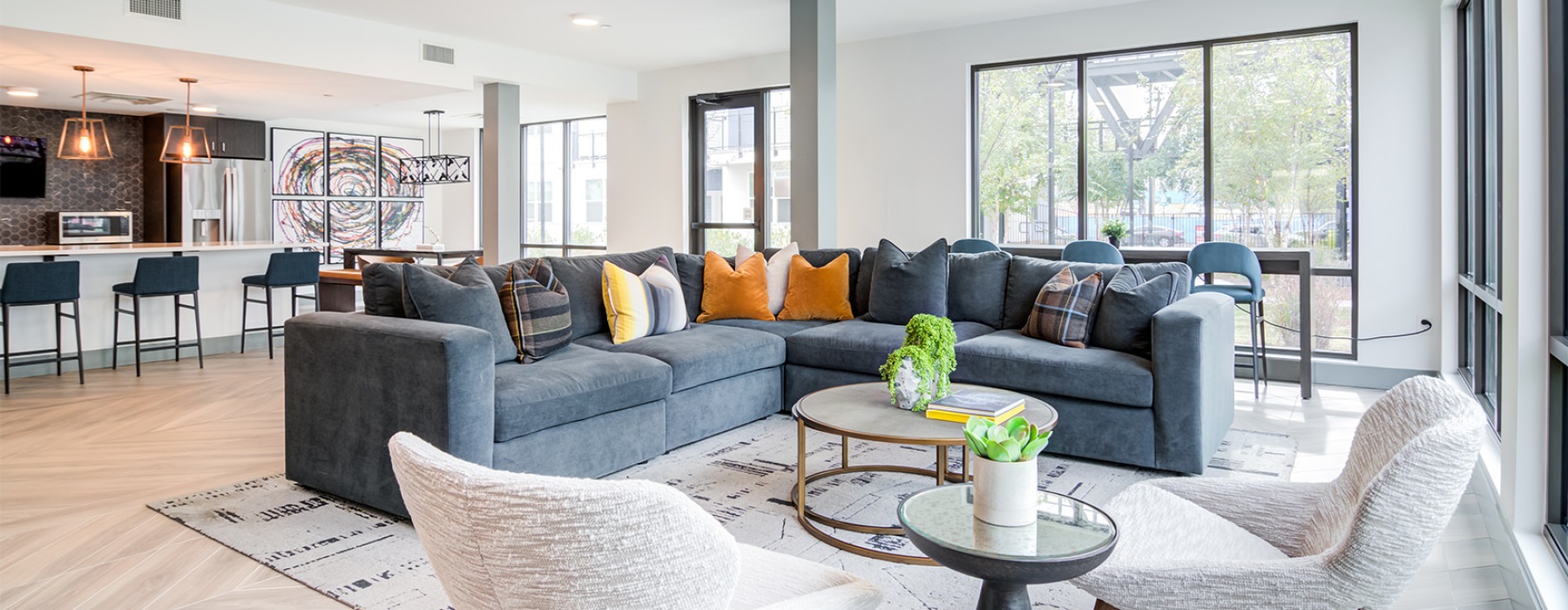 resident clubhouse with a large sectional and coffee table